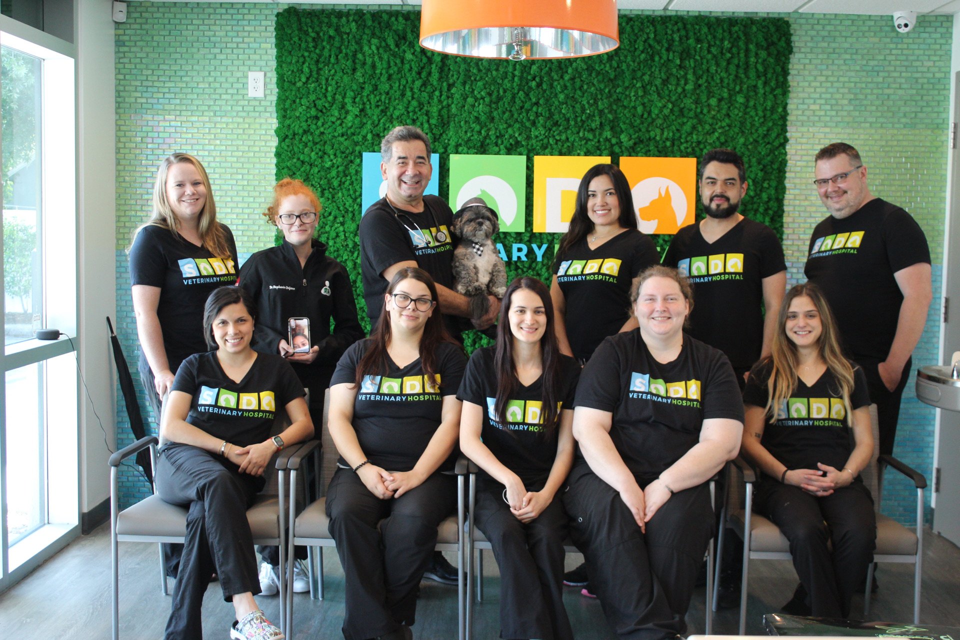 The SODO Veterinarian team posing for a group photo in the Orlando office. 